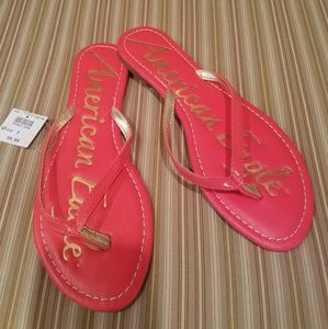 Coral/Orange flip flops, new, size 7
